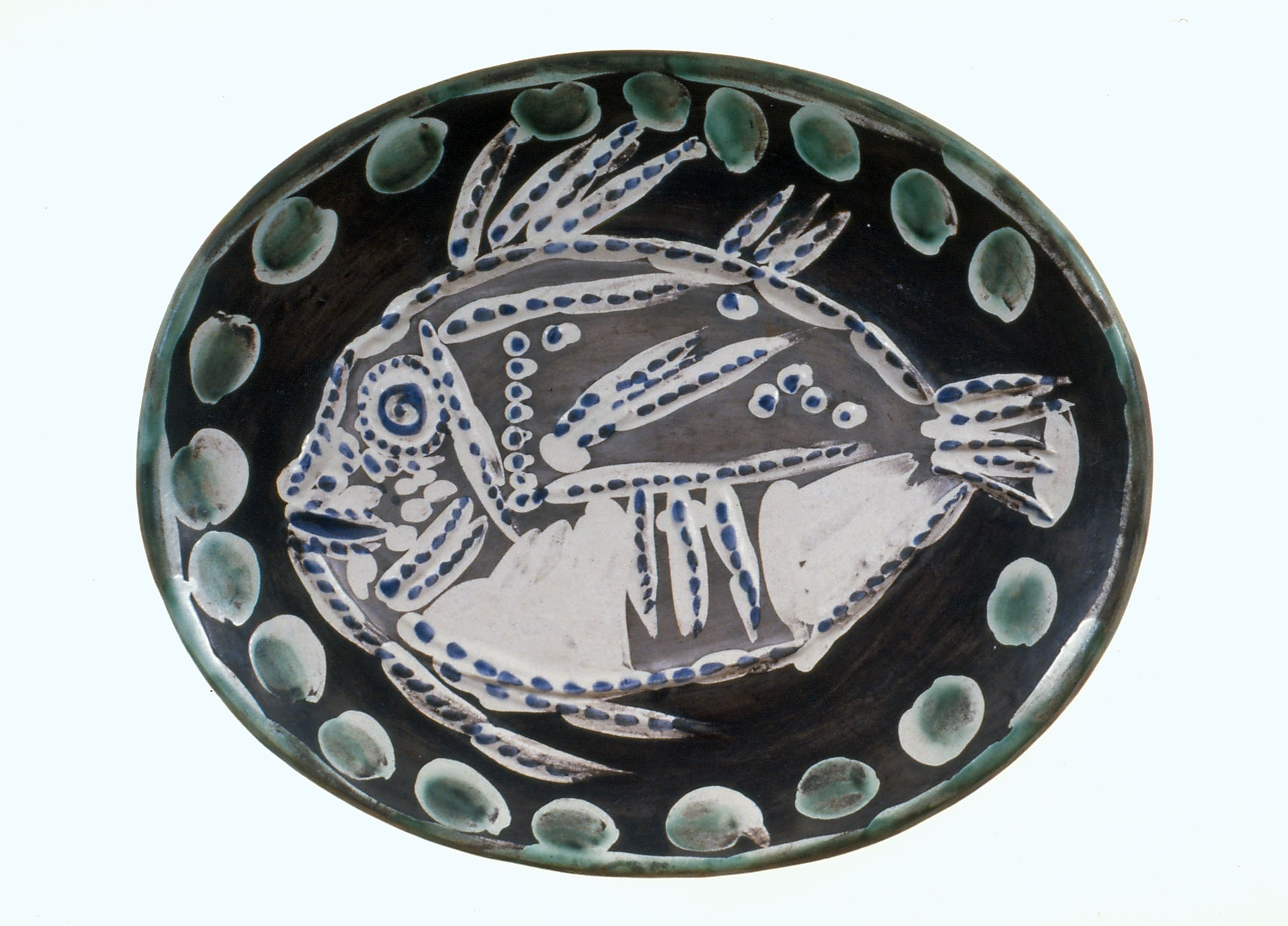 glazed ceramic platter with a fish on it