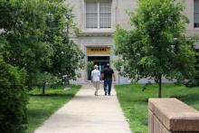two people walking into the museums entrance