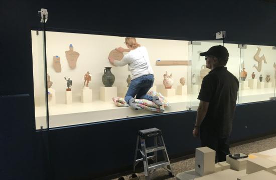  Museum Registrar and Collections Manager Sarah Thomson and Curator of Antiquities Benton Kidd work to reinstall objects.